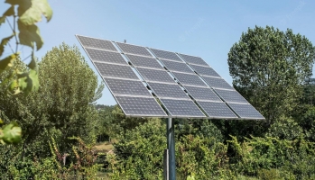 How can you save money and help the environment with a solar photovoltaic system?
